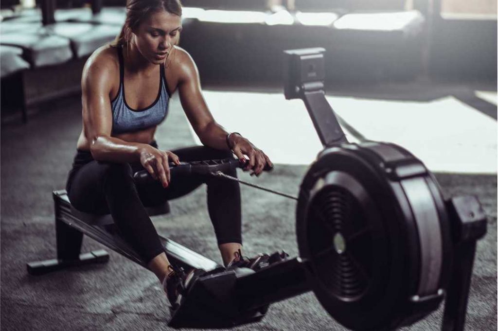 girl on rowing machine