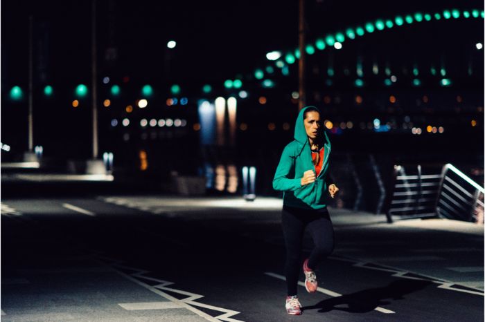 Woman jogging at night